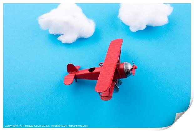 Toy airplane in sky  Print by Turgay Koca