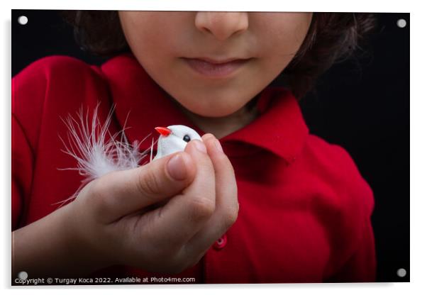 Little  boy holding a fake  bird on black backgrou Acrylic by Turgay Koca