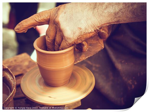 Potter`s hands shaping up the clay Print by Turgay Koca