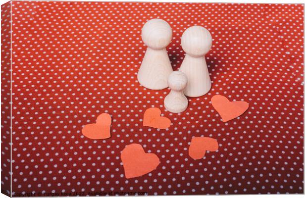 Heart shapes and wooden figurines of people as fam Canvas Print by Turgay Koca