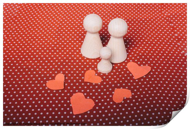 Heart shapes and wooden figurines of people as fam Print by Turgay Koca
