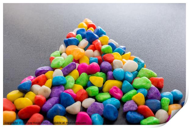 Pile of colorful pebbles as a stone background Print by Turgay Koca
