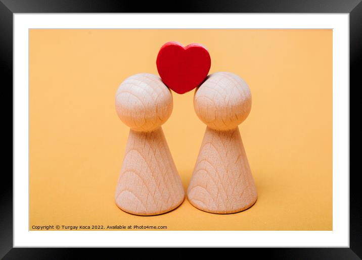 Heart shapes and wooden figurines of people as fam Framed Mounted Print by Turgay Koca