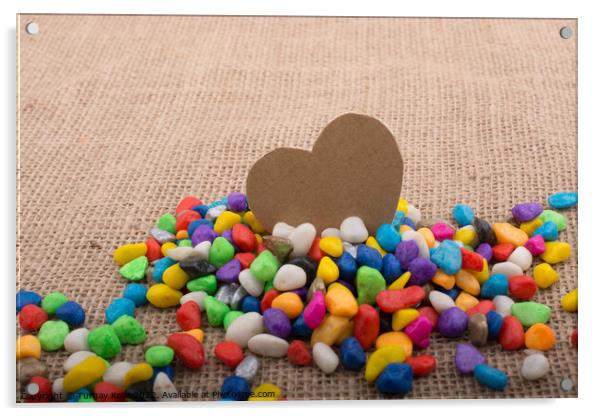 Paper heart amid pebbles on canvas ground Acrylic by Turgay Koca