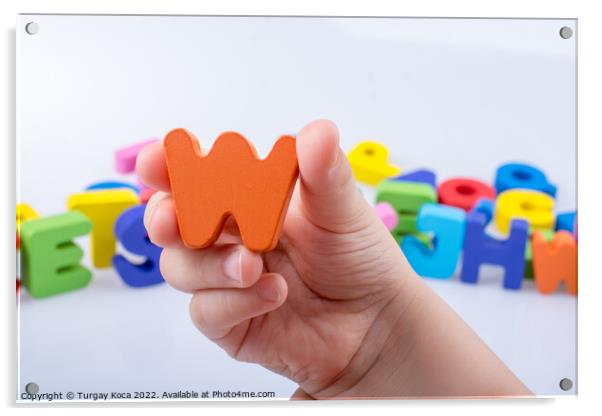 Hand holding Letter cube  W of  Alphabet Acrylic by Turgay Koca