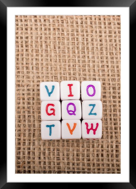 Colorful alphabet letter cubes on a canvas Framed Mounted Print by Turgay Koca