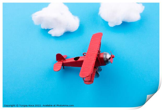 Toy airplane in sky  Print by Turgay Koca