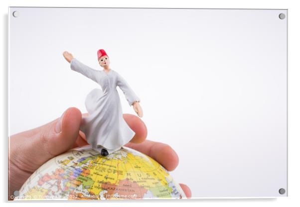 Hand holding a Derviş on a globe Acrylic by Turgay Koca
