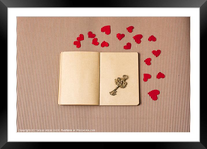 paper hearts around notebook with a retro key  Framed Mounted Print by Turgay Koca
