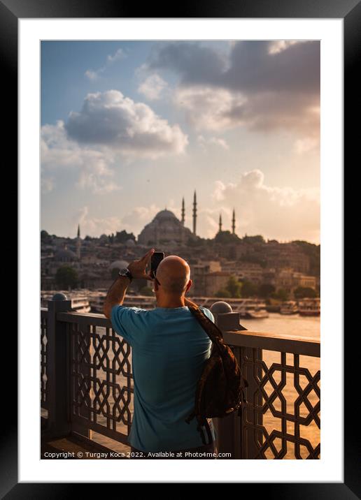 Man  taking pictures on Galata bridge. Vacation in Istanbul.  Framed Mounted Print by Turgay Koca