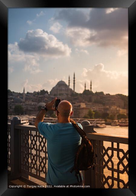 Man  taking pictures on Galata bridge. Vacation in Istanbul.  Framed Print by Turgay Koca