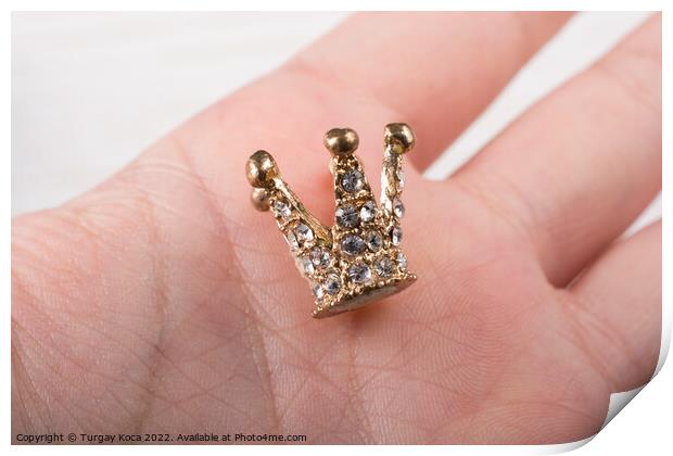 Little model crown is placed in hand Print by Turgay Koca