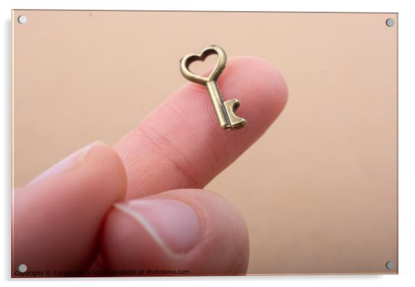 Tiny key with heart shape on the finger tip Acrylic by Turgay Koca