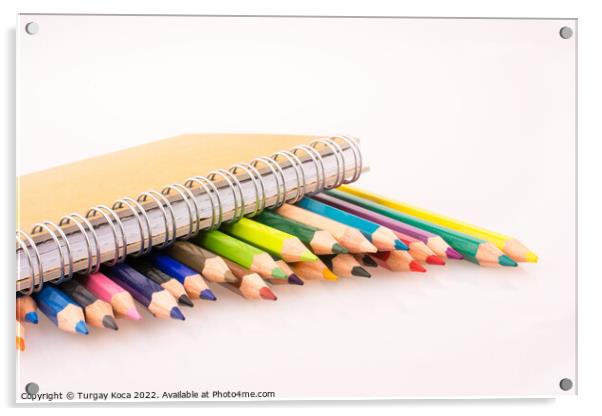 color pencils of various colors near a notebook Acrylic by Turgay Koca