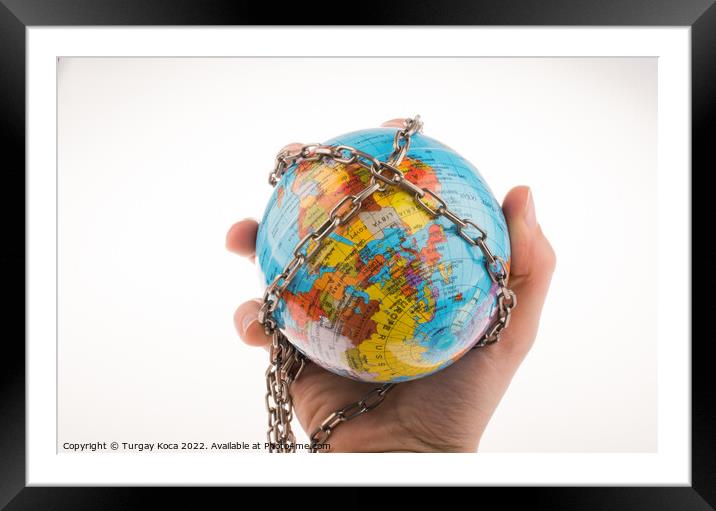 Chained globe Framed Mounted Print by Turgay Koca