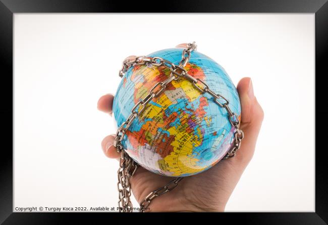 Chained globe Framed Print by Turgay Koca