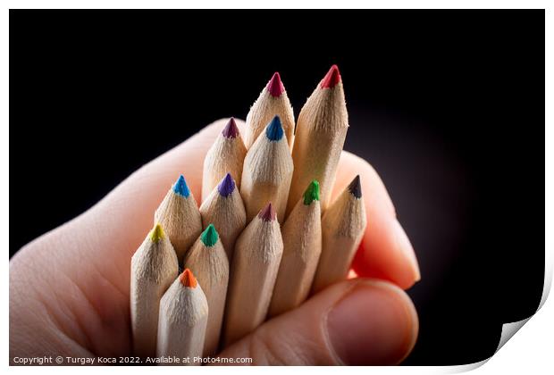 Hand holding colored pencils for creative idea and concept.  Print by Turgay Koca
