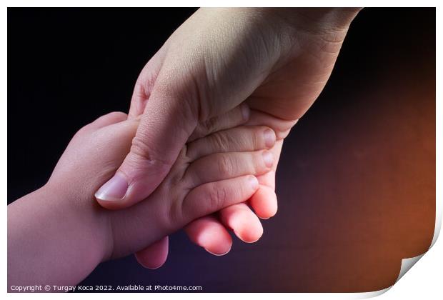 Adult and child hold hands Print by Turgay Koca