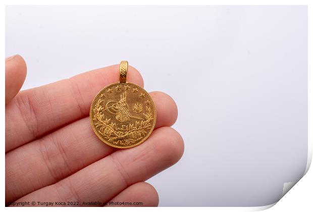 Turkish Ottoman style gold coin in hand Print by Turgay Koca