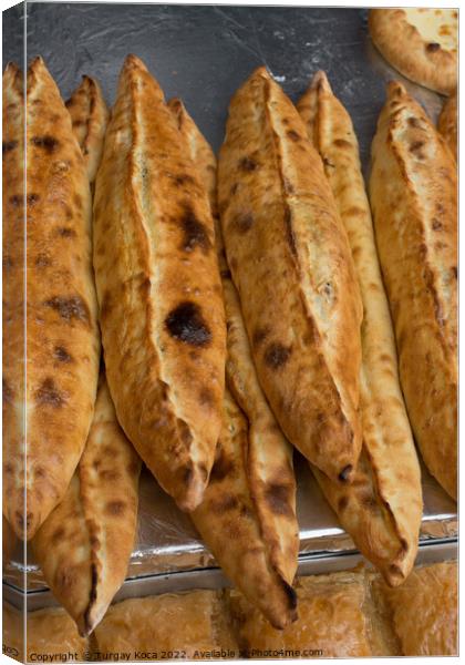 Turkish flat bread covered with cheese Canvas Print by Turgay Koca