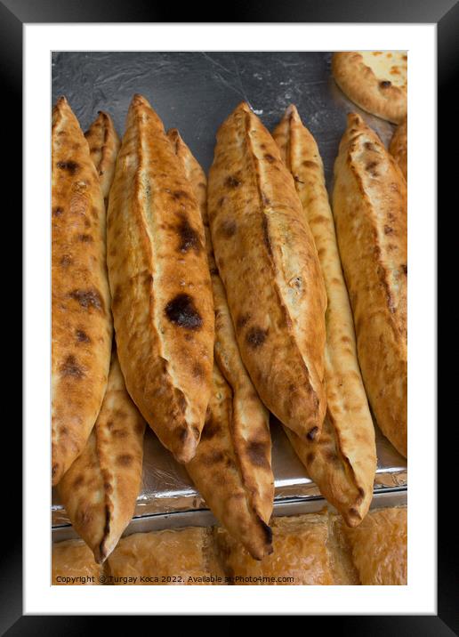 Turkish flat bread covered with cheese Framed Mounted Print by Turgay Koca