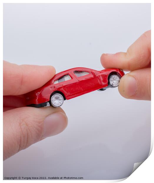 Child giving out little toy car Print by Turgay Koca