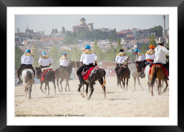 Horseman riding in their ethnic clothes on horse   Framed Mounted Print by Turgay Koca