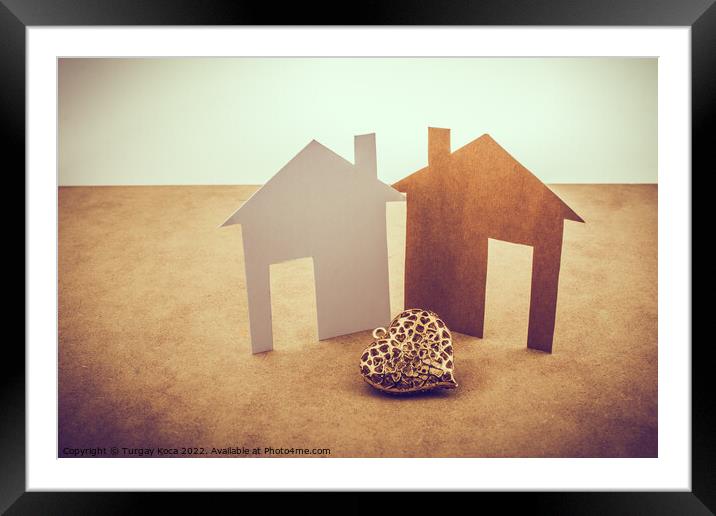 Heart shaped icon and paper houses Framed Mounted Print by Turgay Koca