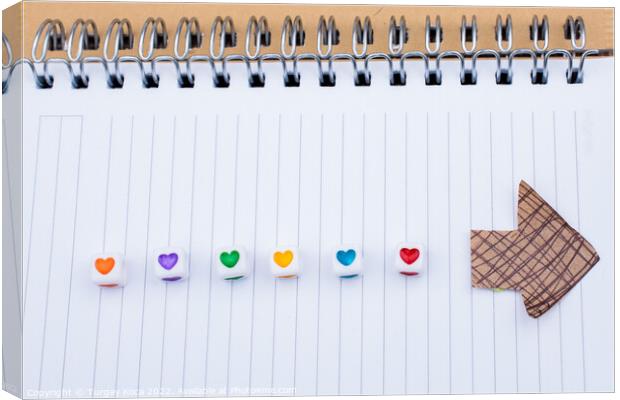 Love cubes and paper arrow on a notebook  Canvas Print by Turgay Koca