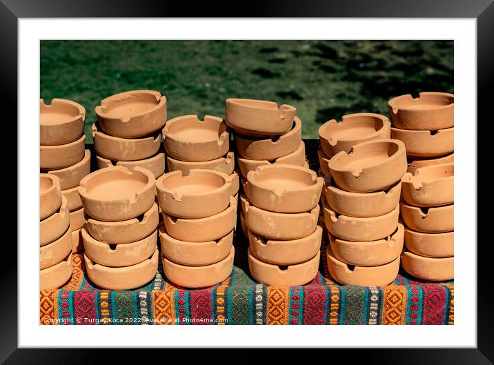 Set of brown ceramic ashtrays Framed Mounted Print by Turgay Koca