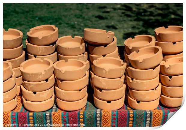 Set of brown ceramic ashtrays Print by Turgay Koca