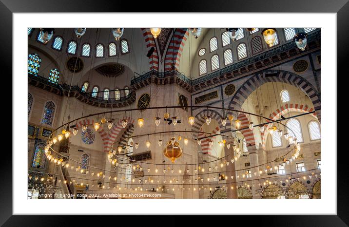 Bright mosque lamps on a circular chandelier Framed Mounted Print by Turgay Koca