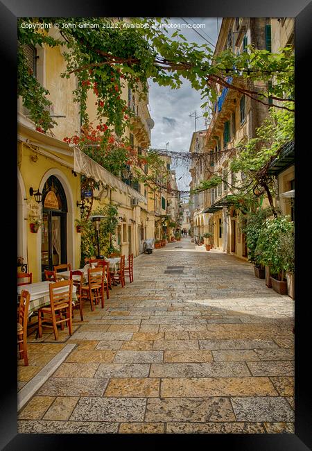 Shaded street in Corfu Town Framed Print by John Gilham