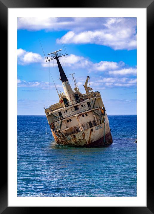 Ship run aground in the Mediterranean off the coas Framed Mounted Print by Vassos Kyriacou