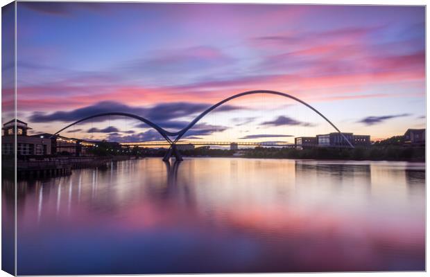 Fiery sunset over the Infinity Bridge Canvas Print by Kevin Winter