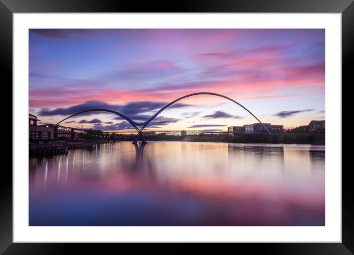 Fiery sunset over the Infinity Bridge Framed Mounted Print by Kevin Winter