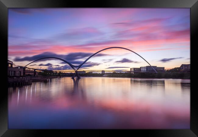 Fiery sunset over the Infinity Bridge Framed Print by Kevin Winter