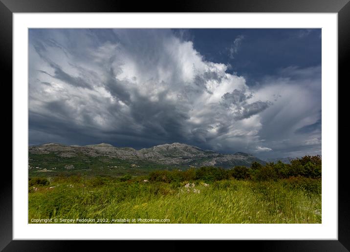 Mountain landscape with dramatic sky. A storm is coming from the mountains. Framed Mounted Print by Sergey Fedoskin