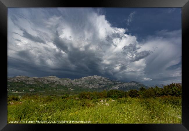 Mountain landscape with dramatic sky. A storm is coming from the mountains. Framed Print by Sergey Fedoskin