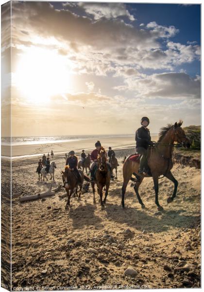Beach Horse Riders  Canvas Print by Simon Connellan