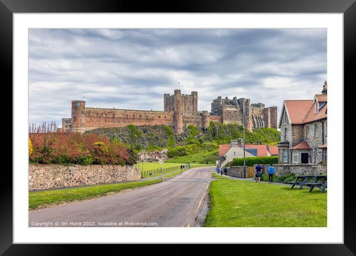 Bamburgh Castle and Village Framed Mounted Print by Jim Monk