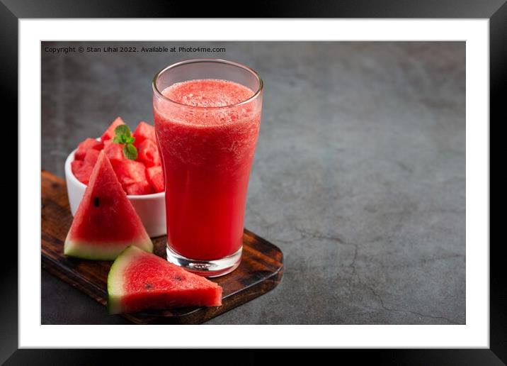 Cold watermelon smoothie on dark background Framed Mounted Print by Stan Lihai