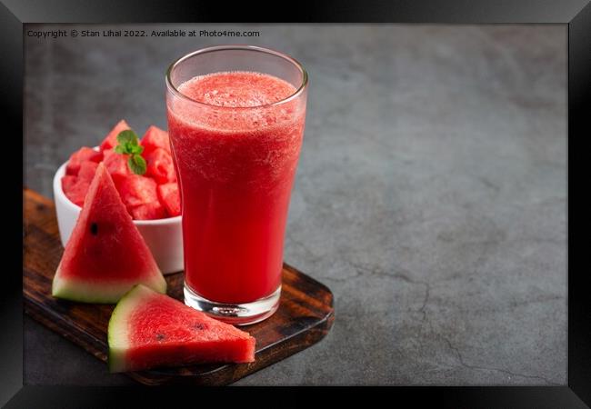 Cold watermelon smoothie on dark background Framed Print by Stan Lihai