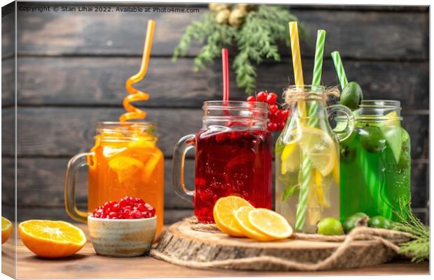 organic fresh juices in bottles served with straws Canvas Print by Stan Lihai