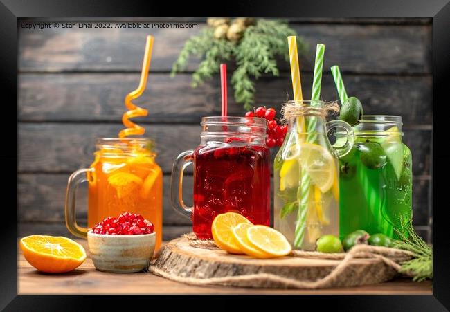 organic fresh juices in bottles served with straws Framed Print by Stan Lihai