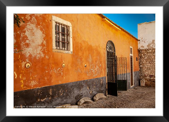 Colourful old building with wrought iron gate in F Framed Mounted Print by Vassos Kyriacou