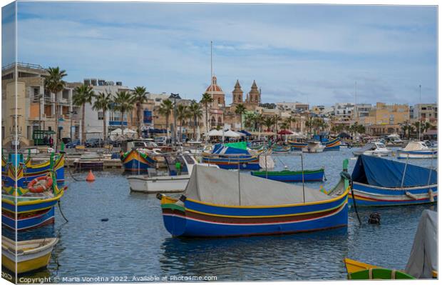 Traditional colorful fishing boats in fishing village Canvas Print by Maria Vonotna