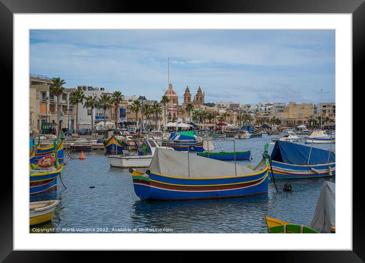 Traditional colorful fishing boats in fishing village Framed Mounted Print by Maria Vonotna