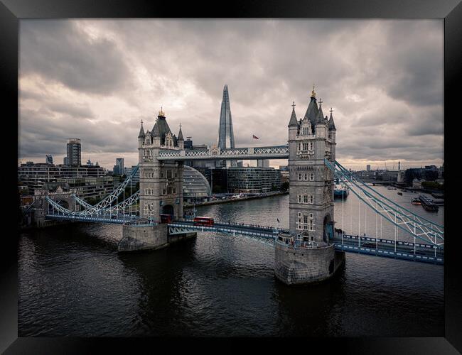 Tower Bridge London against dramatic sky Framed Print by Erik Lattwein