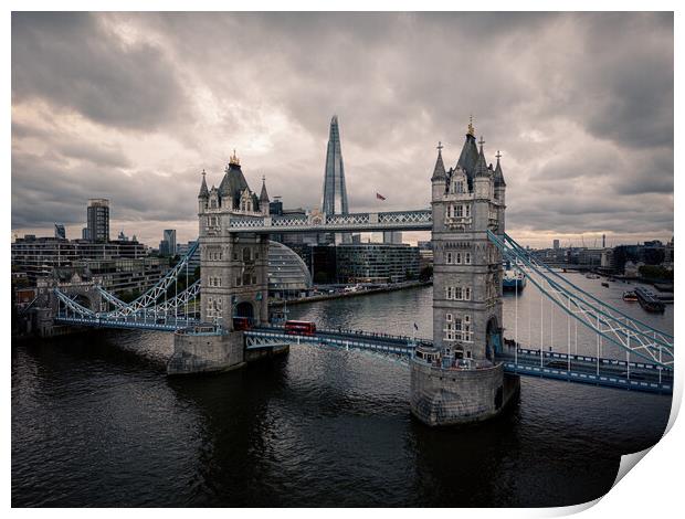Tower Bridge London against dramatic sky Print by Erik Lattwein